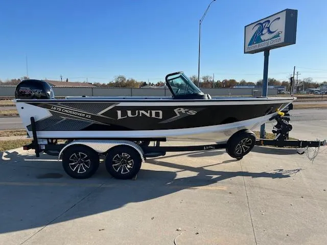 Slide: The Image of 2024 Lund 1875 Crossover XS boat on a trailer at a dealership. - 0