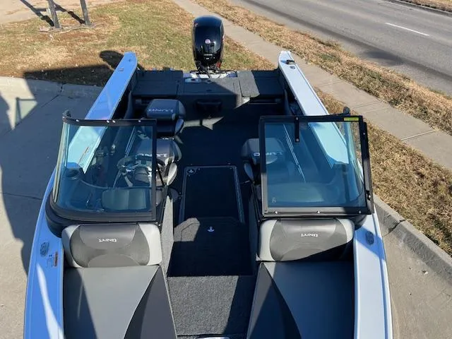 Slide: The Image of 2024 Lund 1875 Crossover XS boat with open windshield and seating. - 3