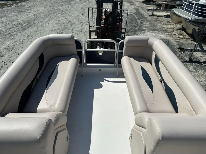 Slide: The Image of 2014 Godfrey Hurricane boat interior with beige seating. - 10