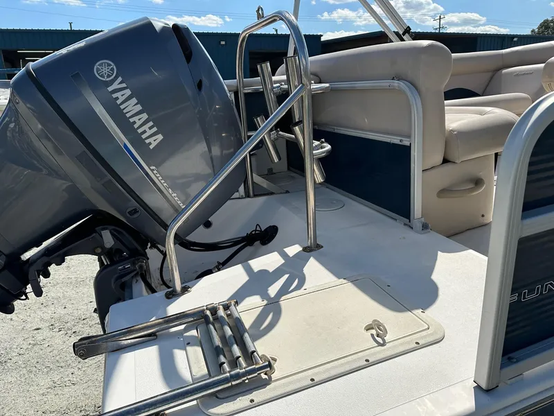 Slide: The Image of 2014 Godfrey Hurricane boat with Yamaha outboard motor and seating area. - 13