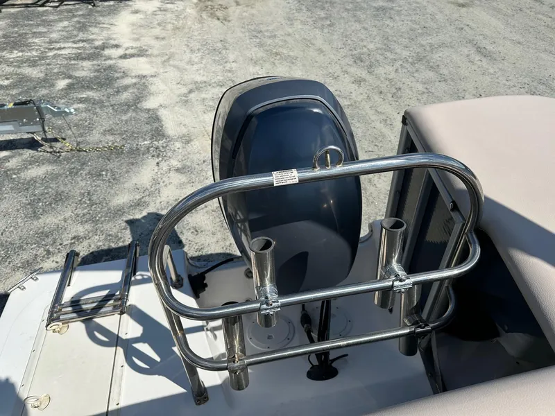 Slide: The Image of 2014 Godfrey Hurricane boat with outboard motor and stainless steel rail. - 14