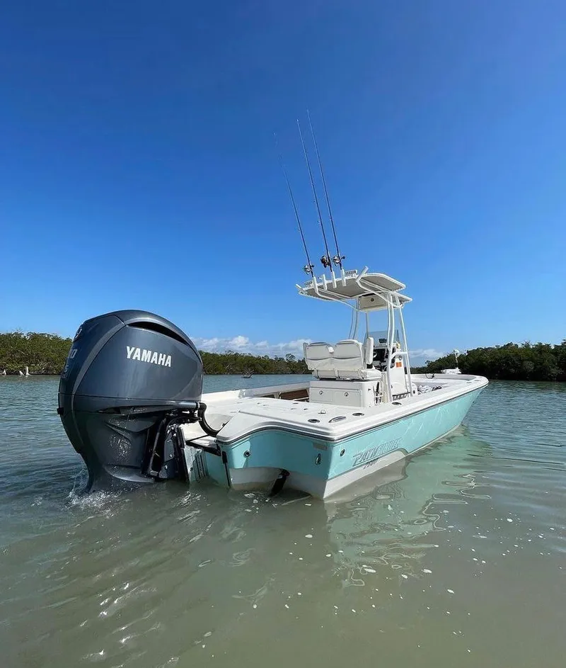 Slide: The Image of 2014 Pathfinder 2600 HPS boat with Yamaha engine in calm waters. - 11