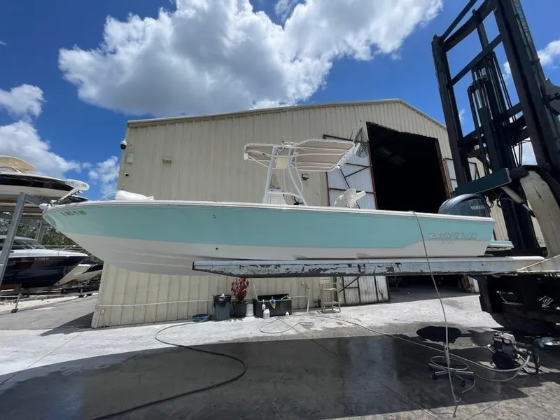 Slide: The Image of 2014 Pathfinder 2600 HPS boat in a boatyard under a blue sky. - 22
