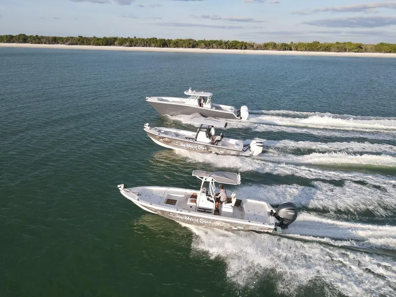 Slide: The Image of Three Pathfinder 2600 HPS boats cruising on open water, 2014 model. - 4