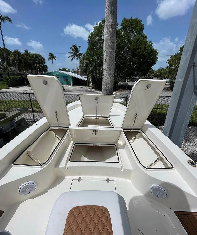 Slide: The Image of 2014 Pathfinder 2600 HPS boat with open storage compartments. - 9