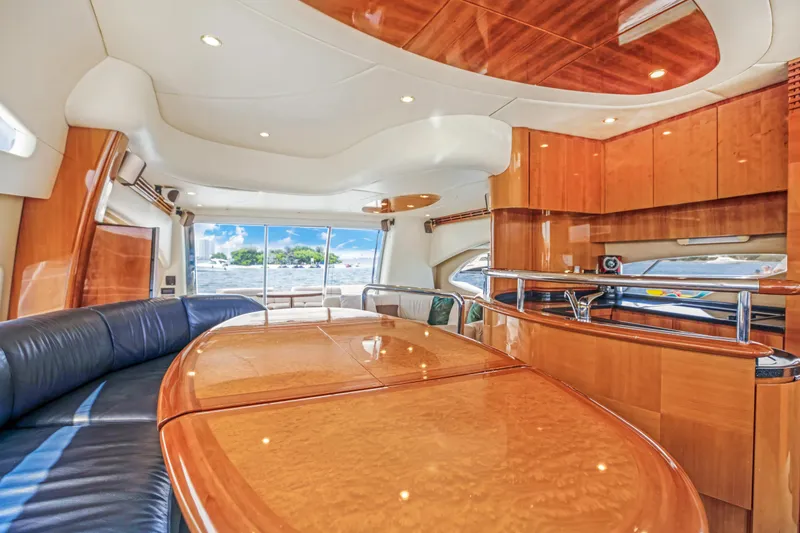 Slide: The Image of Luxurious interior of a 2004 Azimut 62 yacht with polished wood finishes. - 14