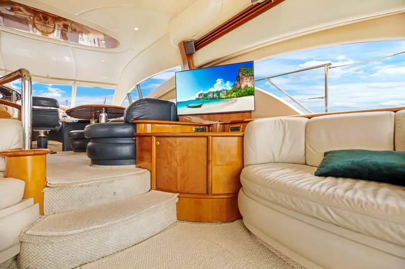 Slide: The Image of Luxurious interior of a 2004 Azimut 62 yacht with leather seating and a flat-screen TV. - 18