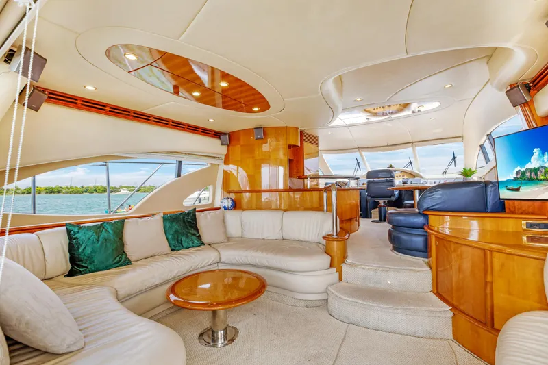 Slide: The Image of Luxurious interior of 2004 Azimut 62 yacht with plush seating and modern amenities. - 5
