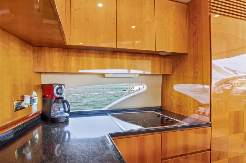 Slide: The Image of Luxurious kitchen interior of a 2004 Azimut 62 yacht with modern appliances. - 8