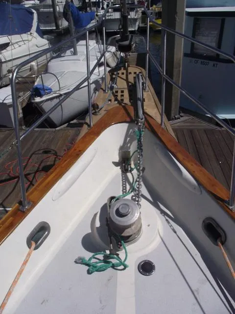 Slide: The Image of 1984 Irwin Center Cockpit sailboat deck with anchor chain and winch at marina. - 10