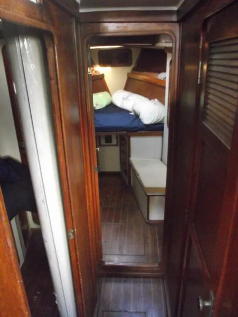 Slide: The Image of 1984 Irwin Center Cockpit interior with wooden finish and cozy sleeping area. - 13