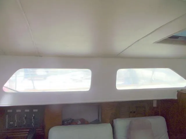 Slide: The Image of Interior of 1984 Irwin Center Cockpit sailboat with windows and seating area. - 21