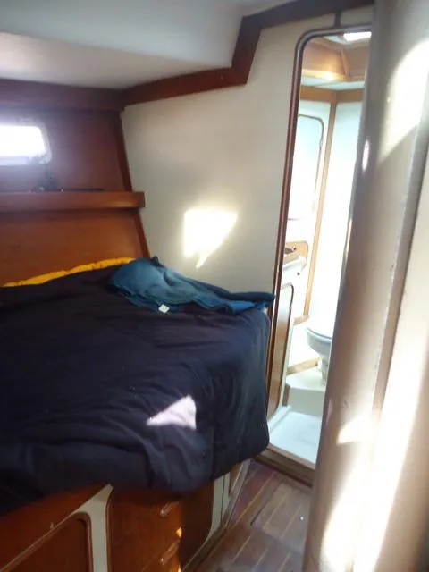 Slide: The Image of 1984 Irwin Center Cockpit interior with bed and bathroom view. - 24