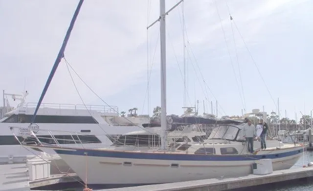 Slide: The Image of 1984 Irwin Center Cockpit sailboat docked at marina with people on deck. - 3
