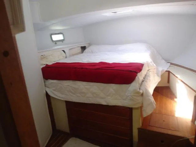 Slide: The Image of Cozy cabin interior of 1984 Irwin Center Cockpit sailboat with bed and wooden accents. - 31