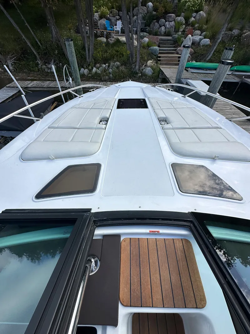 Slide: The Image of 2015 Cobalt A40 boat docked at a marina, view from the bow. - 33