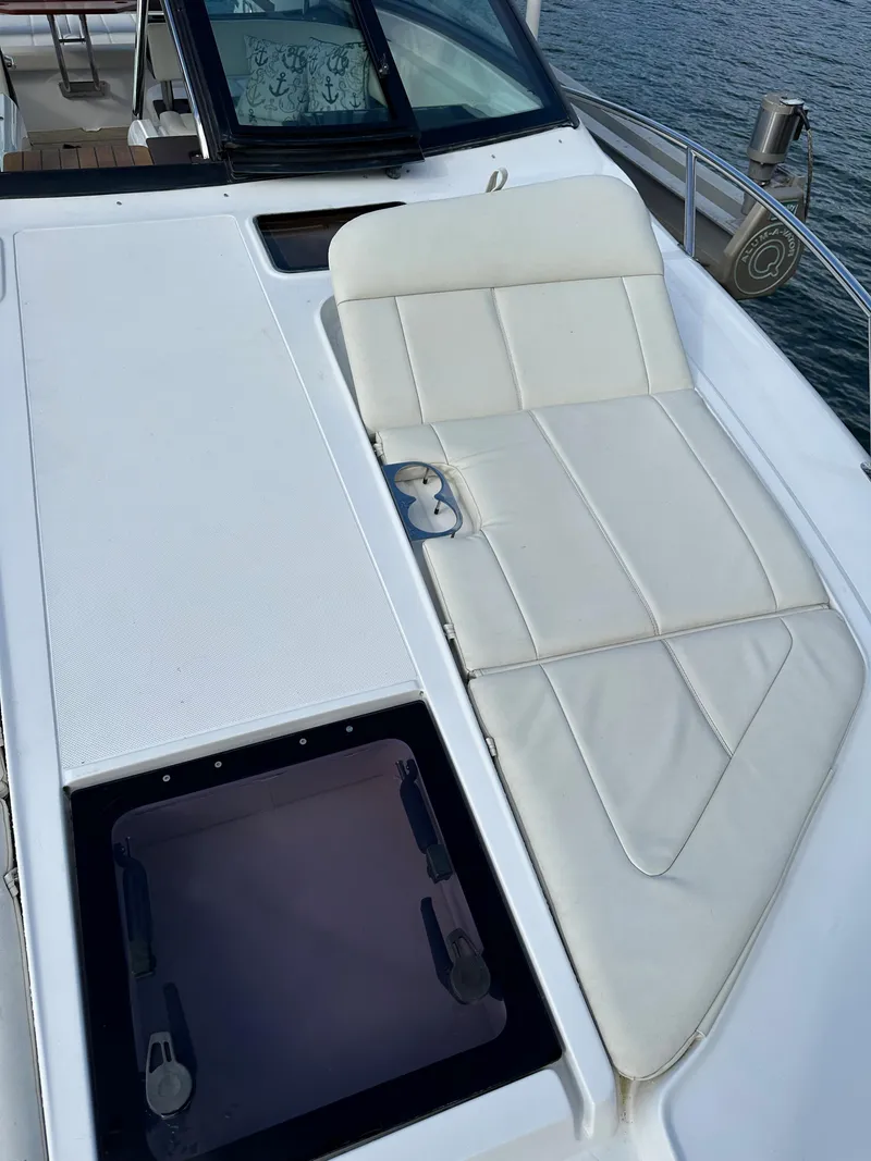 Slide: The Image of 2015 Cobalt A40 boat with white sunbed and hatch on deck. - 35