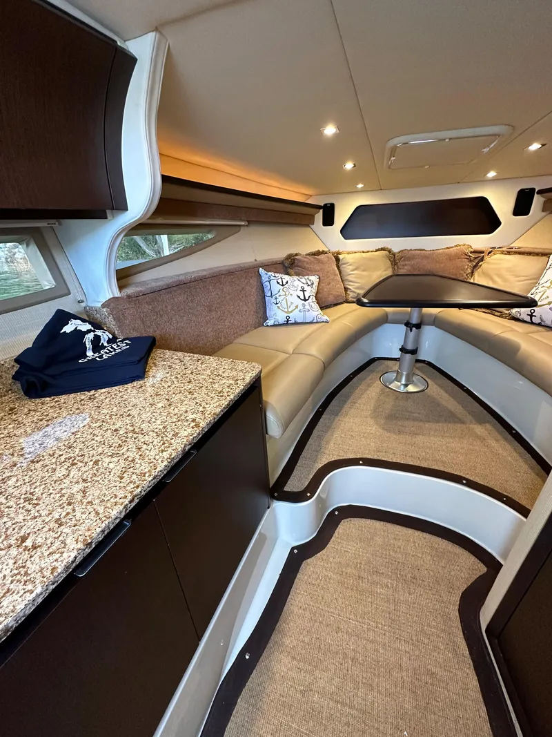 Slide: The Image of Luxurious interior of a 2015 Cobalt A40 boat with granite countertops and plush seating. - 40