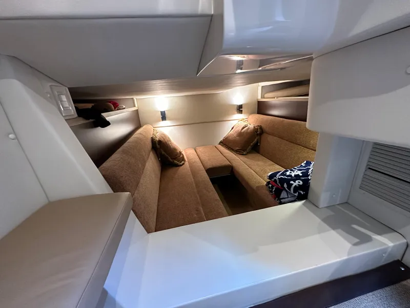 Slide: The Image of Interior cabin of 2015 Cobalt A40 boat with cozy seating and ambient lighting. - 43