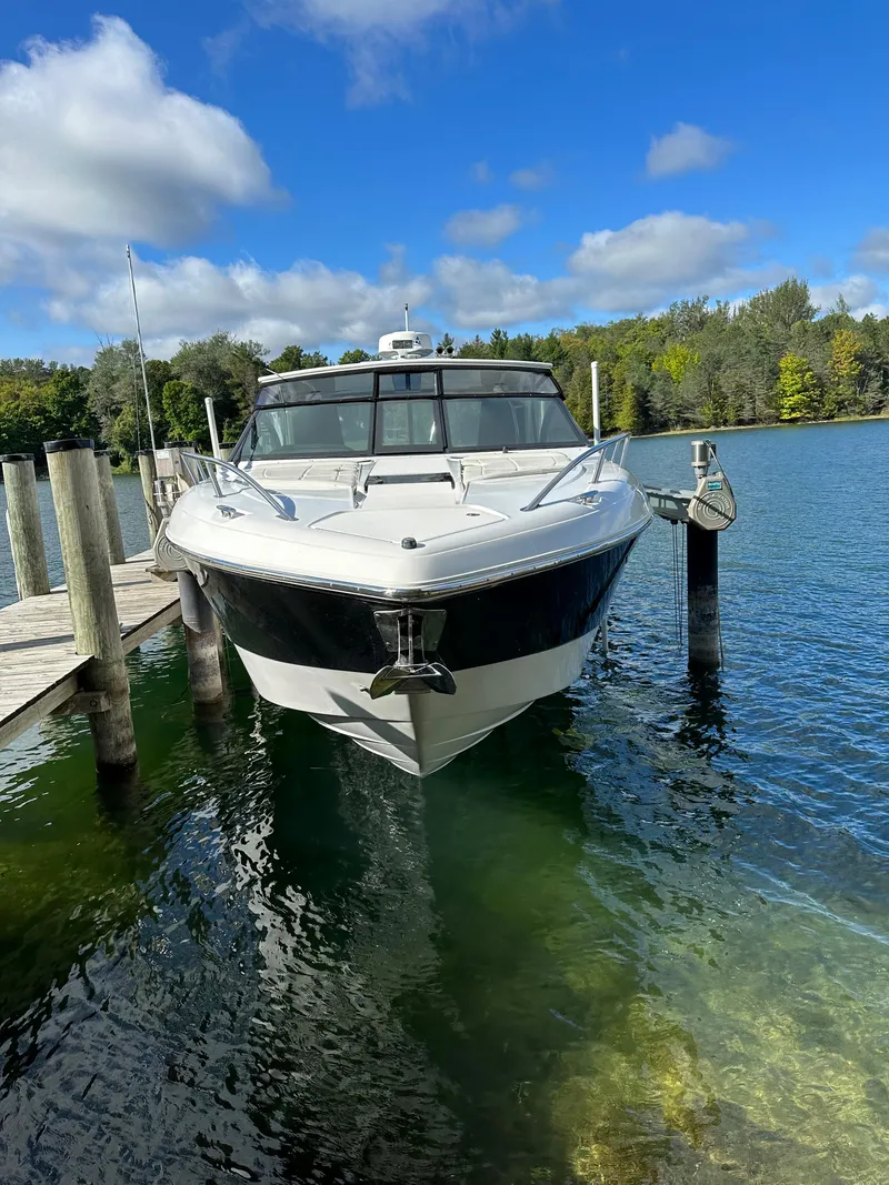Slide: The Image of 2015 Cobalt A40 boat docked on a clear, sunny day. - 46