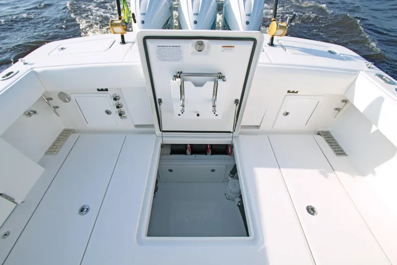 Slide: The Image of 2025 Regulator 37 boat deck with open storage compartment. - 20