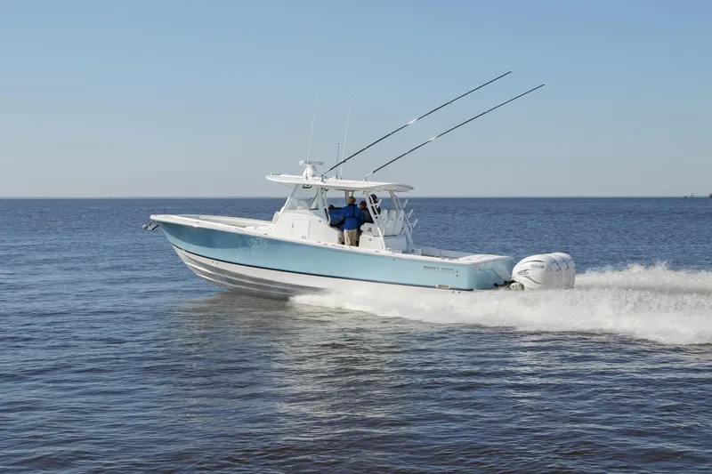 Slide: The Image of 2025 Regulator 37 boat cruising on open water. - 21