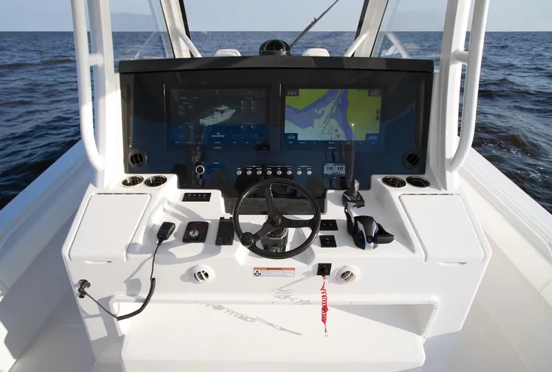 Slide: The Image of 2025 Regulator 37 boat dashboard with advanced navigation and control systems. - 22