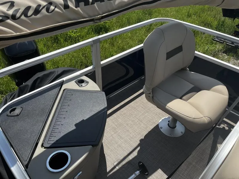 Slide: The Image of 2024 Sun Tracker Bass Buggy 18 DLX boat interior with captain's chair and console. - 5