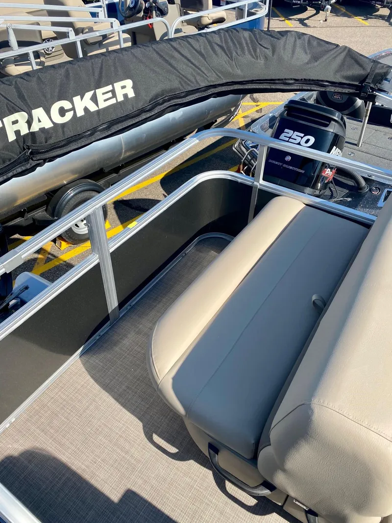Slide: The Image of 2024 Sun Tracker Party Barge 18 DLX pontoon boat with beige seating and 250 HP engine. - 3