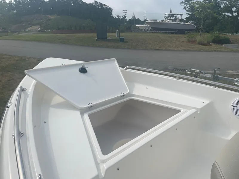 Slide: The Image of 2024 Key West 1720 Center Console boat with open storage compartment. - 7