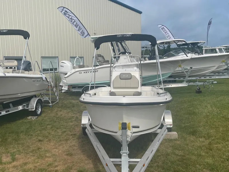 Slide: The Image of 2024 Key West 1720 Center Console boat on trailer, displayed outdoors. - 8