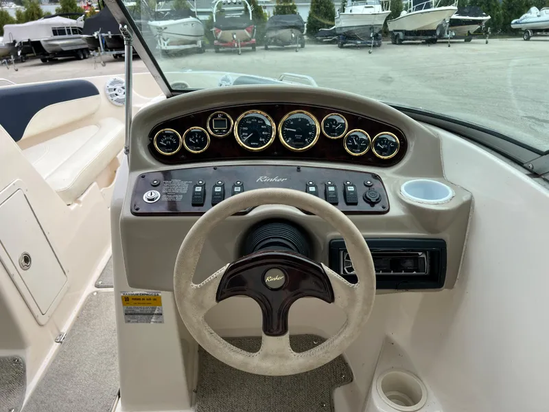 Slide: The Image of 2002 Rinker 212 Captiva Bowrider dashboard and steering wheel. - 14