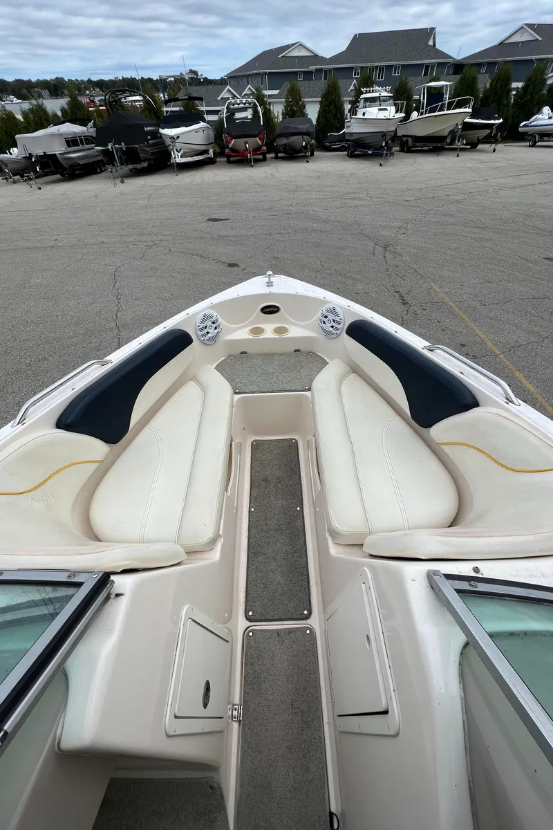 Slide: The Image of 2002 Rinker 212 Captiva Bowrider with spacious seating and modern design. - 16
