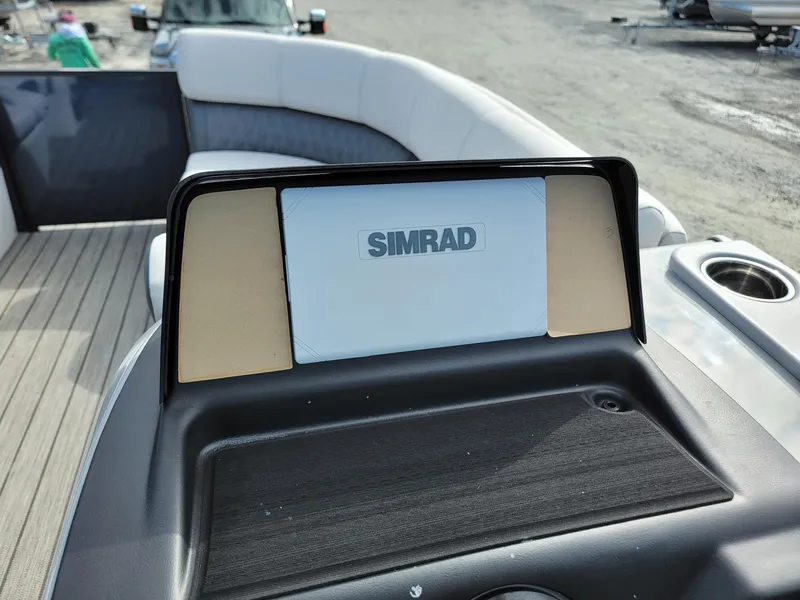 Slide: The Image of Simrad display on 2024 Harris Sunliner 230 Sport boat dashboard. - 14