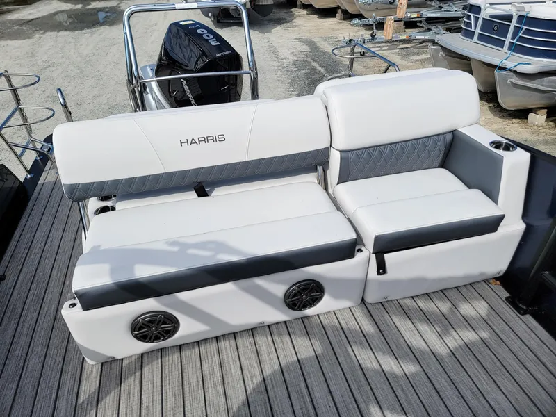 Slide: The Image of 2024 Harris Sunliner 230 Sport boat seating with integrated speakers. - 18