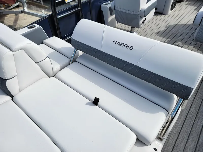 Slide: The Image of 2024 Harris Sunliner 230 Sport boat with luxurious white seating. - 23