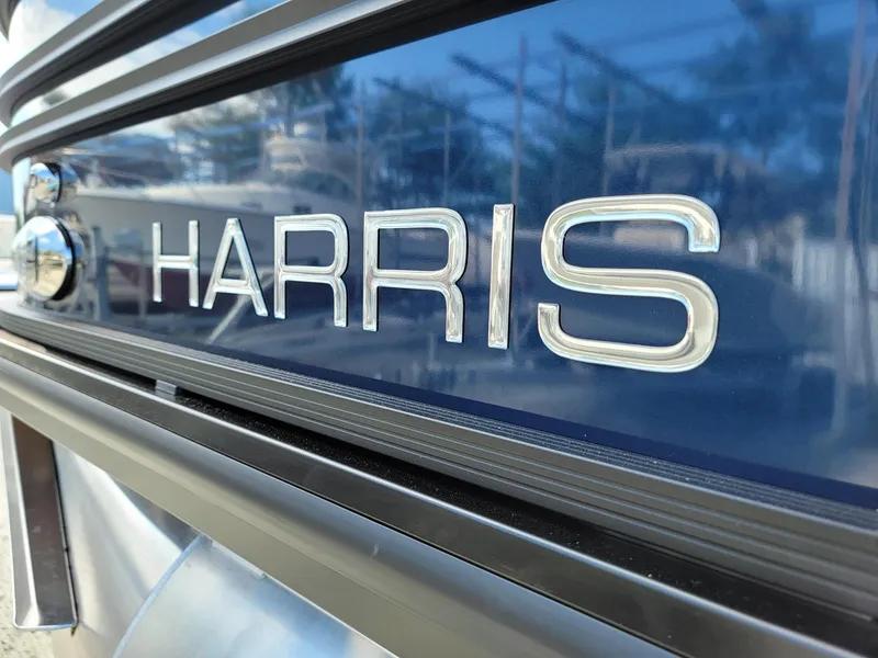 Slide: The Image of Close-up of 2024 Harris Sunliner 230 Sport boat logo. - 31
