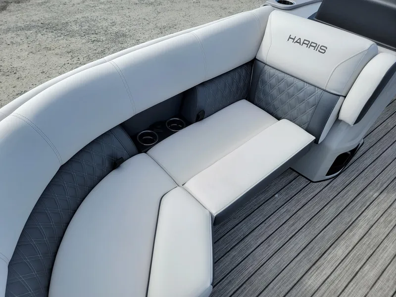 Slide: The Image of 2024 Harris Sunliner 230 Sport boat with luxurious seating and cup holders. - 8