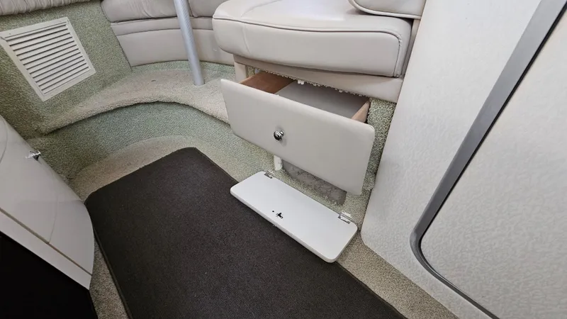 Slide: The Image of Interior of 1999 Maxum 3000 SCR with open storage drawer. - 28