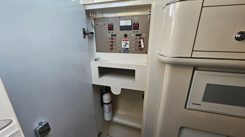 Slide: The Image of Electrical control panel inside a 1999 Maxum 3000 SCR boat. - 29