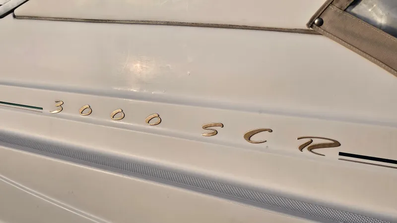 Slide: The Image of 1999 Maxum 3000 SCR boat model nameplate on hull - 32