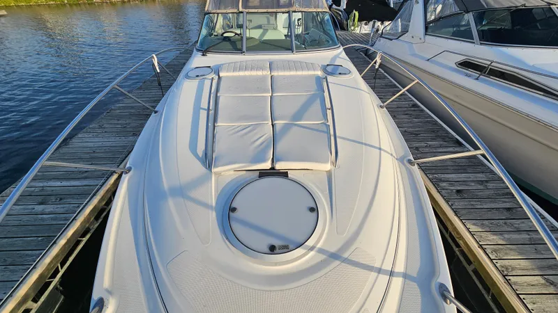 Slide: The Image of 1999 Maxum 3000 SCR boat docked at a marina. - 5