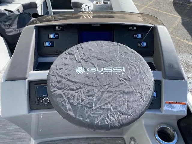 Slide: The Image of 2023 Bennington 25LSB boat dashboard with Gussi Italia steering wheel cover. - 7