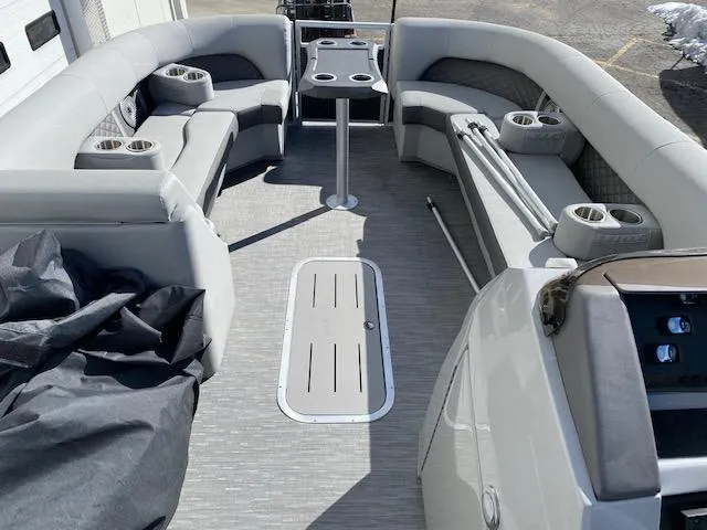 Slide: The Image of 2023 Bennington 25LSB pontoon boat interior with spacious seating and cup holders. - 8