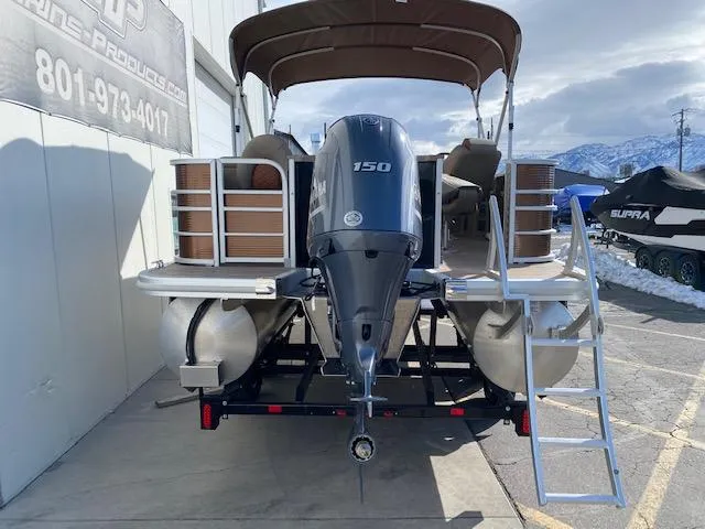 Slide: The Image of 2023 Bennington 22LFAPG pontoon boat with 150 HP engine and ladder. - 12