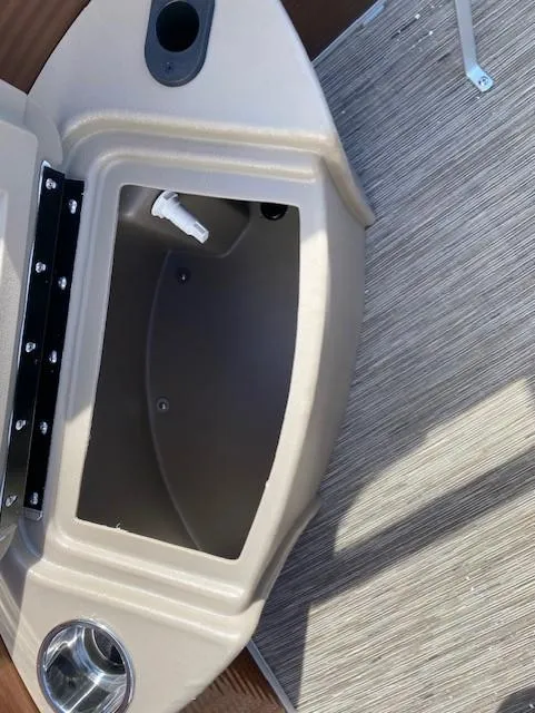Slide: The Image of 2023 Bennington 22LFAPG boat storage compartment and cup holder. - 7
