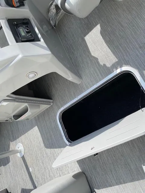 Slide: The Image of 2023 Bennington 22LFB boat interior with open storage compartment. - 9