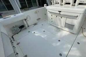Slide: The Image of 2012 Boston Whaler 370 Outrage boat deck with storage compartments and seating. - 12