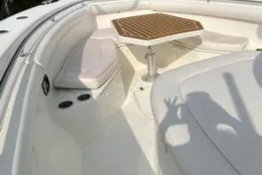 Slide: The Image of 2012 Boston Whaler 370 Outrage boat interior with seating and table. - 8
