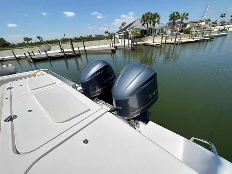 Slide: The Image of 2003 Grady-White 330 Express boat with twin Yamaha outboard engines docked. - 16